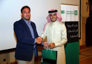 Luigi Wewege receiving a thank you gift from the Kuwait Finance House, Bahrain MD & CEO Mr. Abdulhakeem Alkhayyat