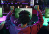 back of man winning video game tournament